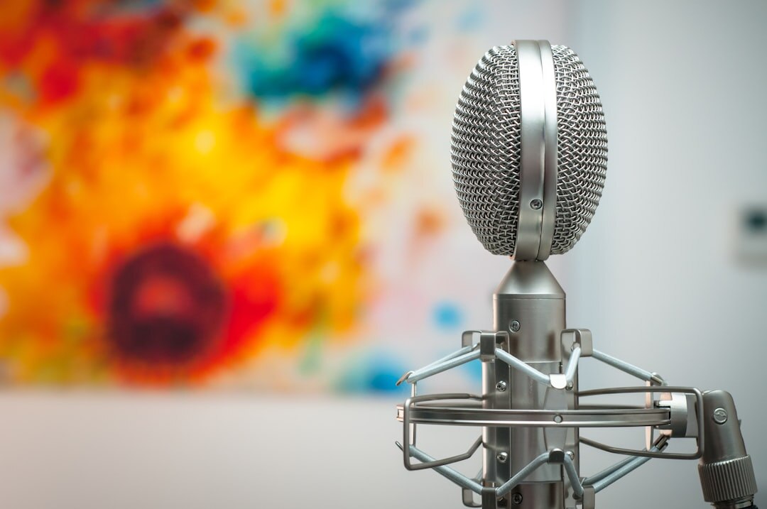 Professional podcast microphone in a modern recording studio with warm lighting