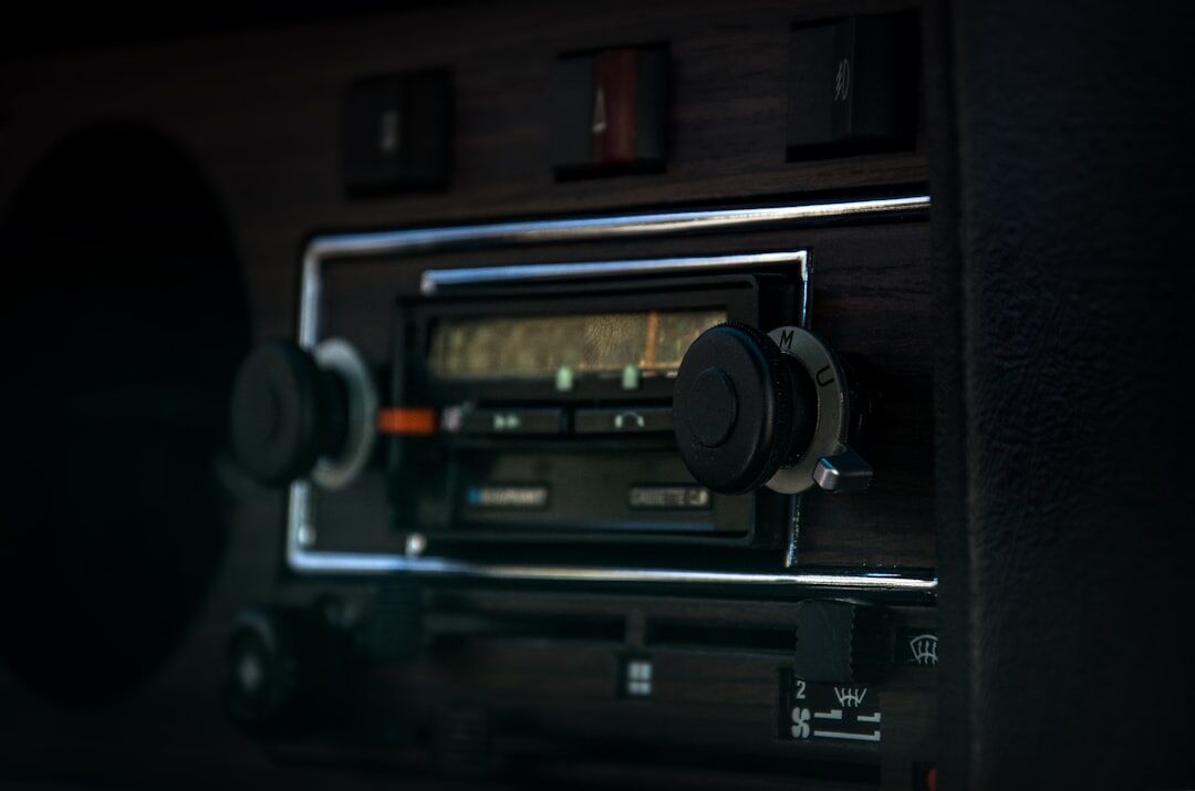 person tuning vintage radio
