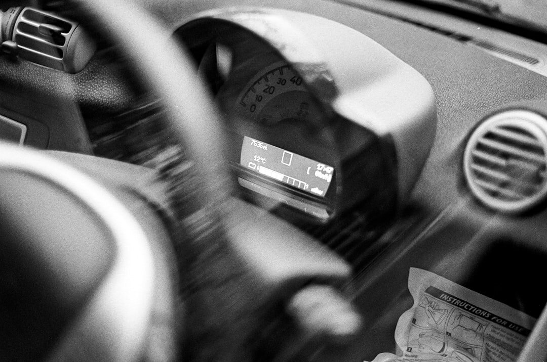 person listening to radio in car