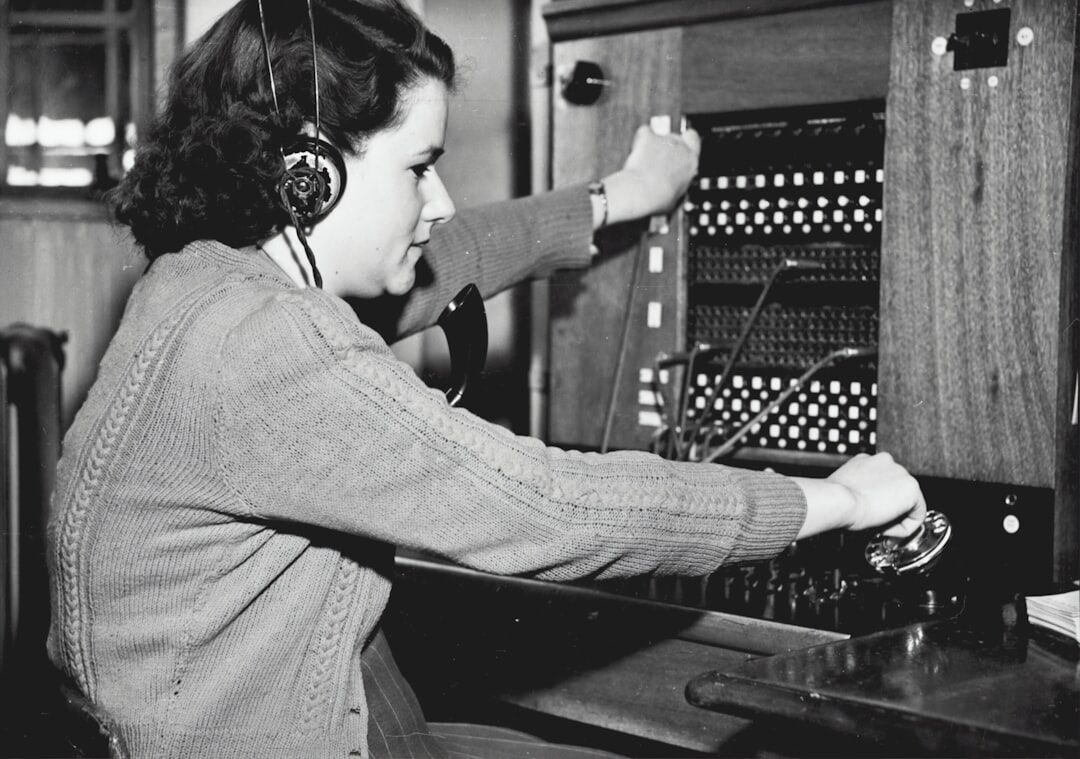 person tuning vintage radio