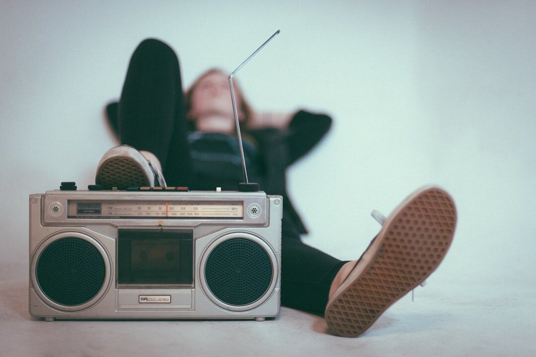 person tuning vintage radio